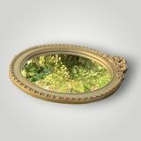 Antique small round wall mirror in gold resin - love knot