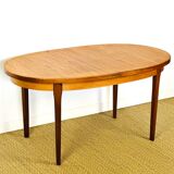 Oval teak dining table with extension