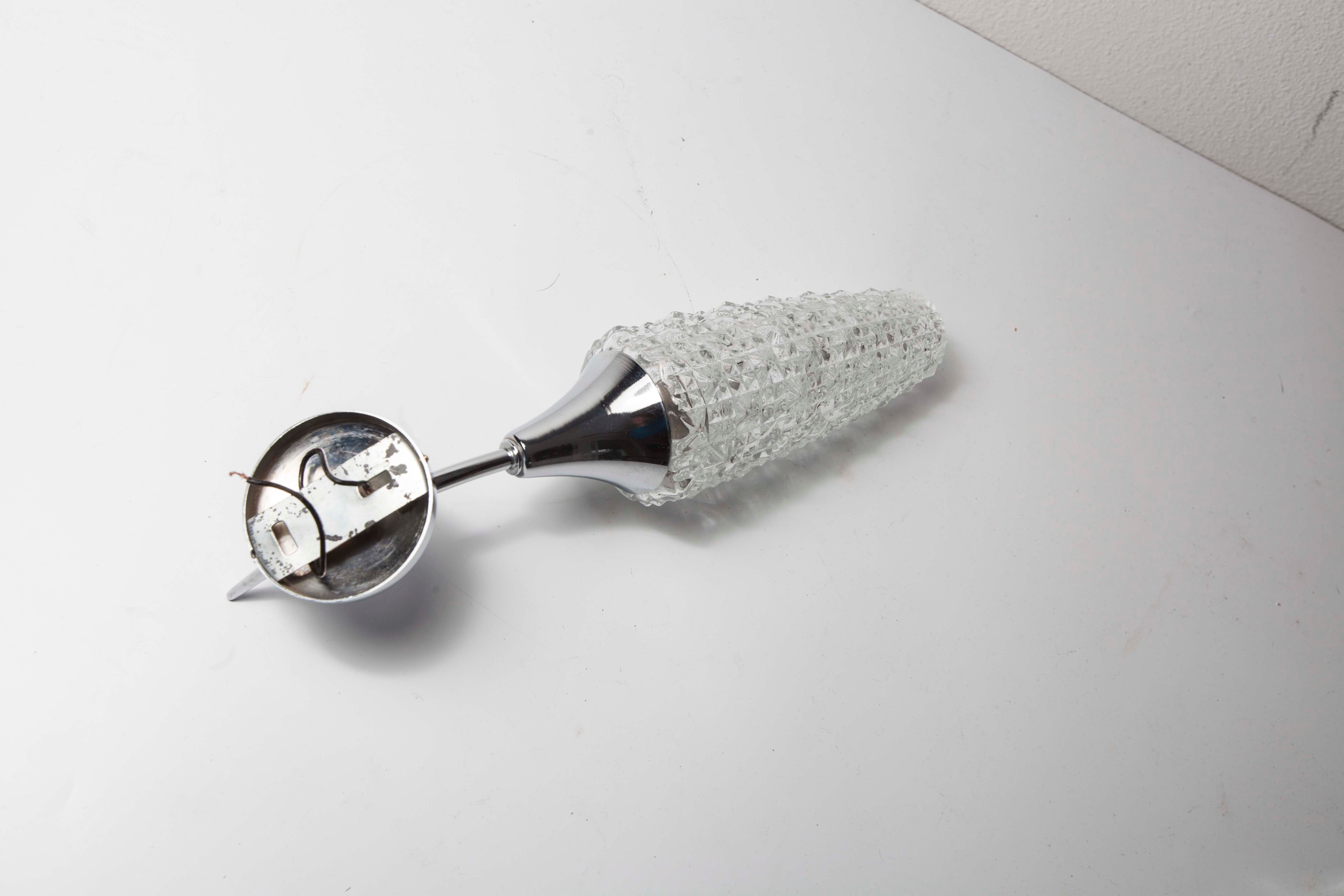 Torch wall lampof the 60s in silver and glass