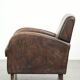Comfortable sheepskin armchair with matching piping and a timeless look