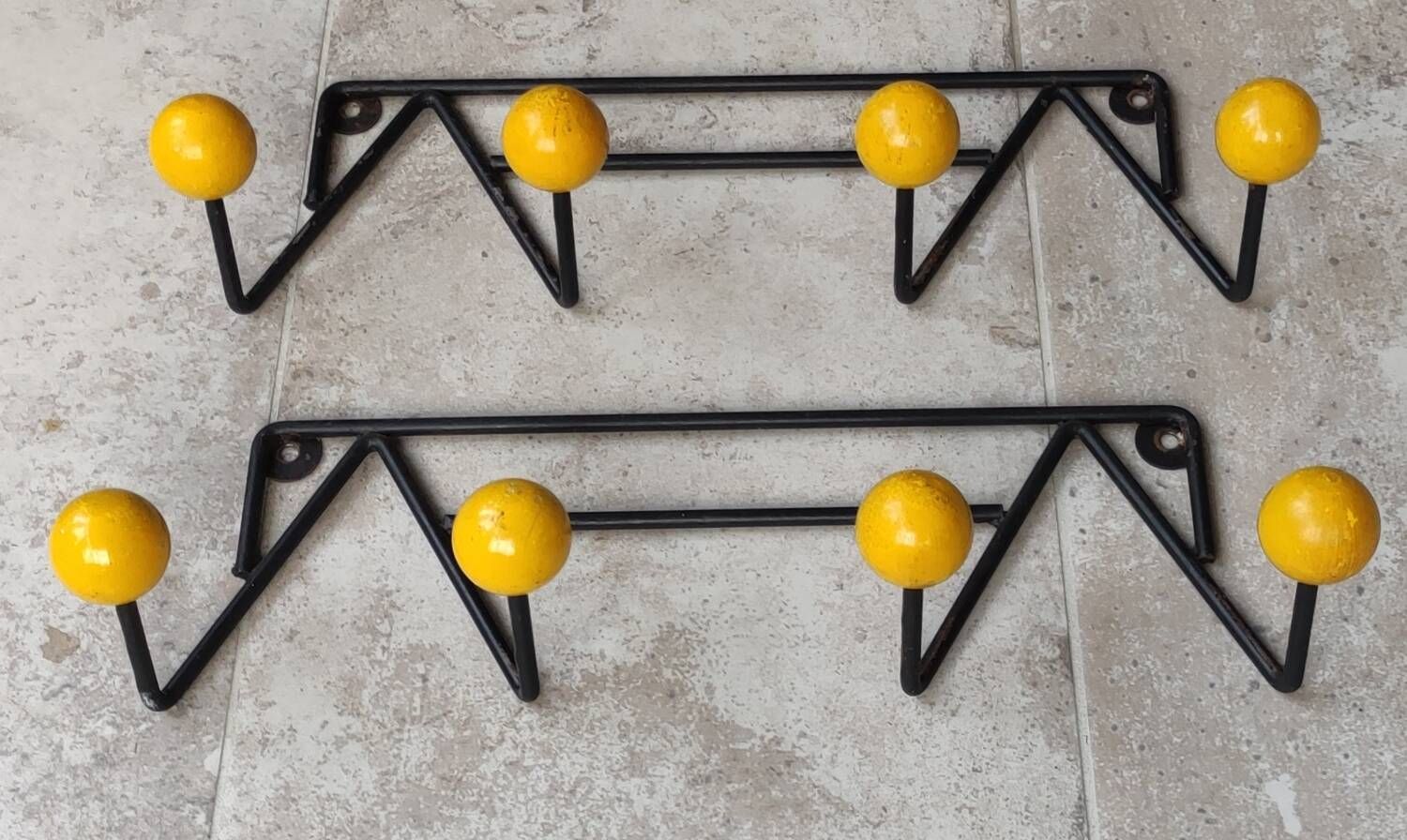 Two vintage metal and wood ball coat racks