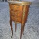 Oval bedside table in Louis XV style with marquetry.