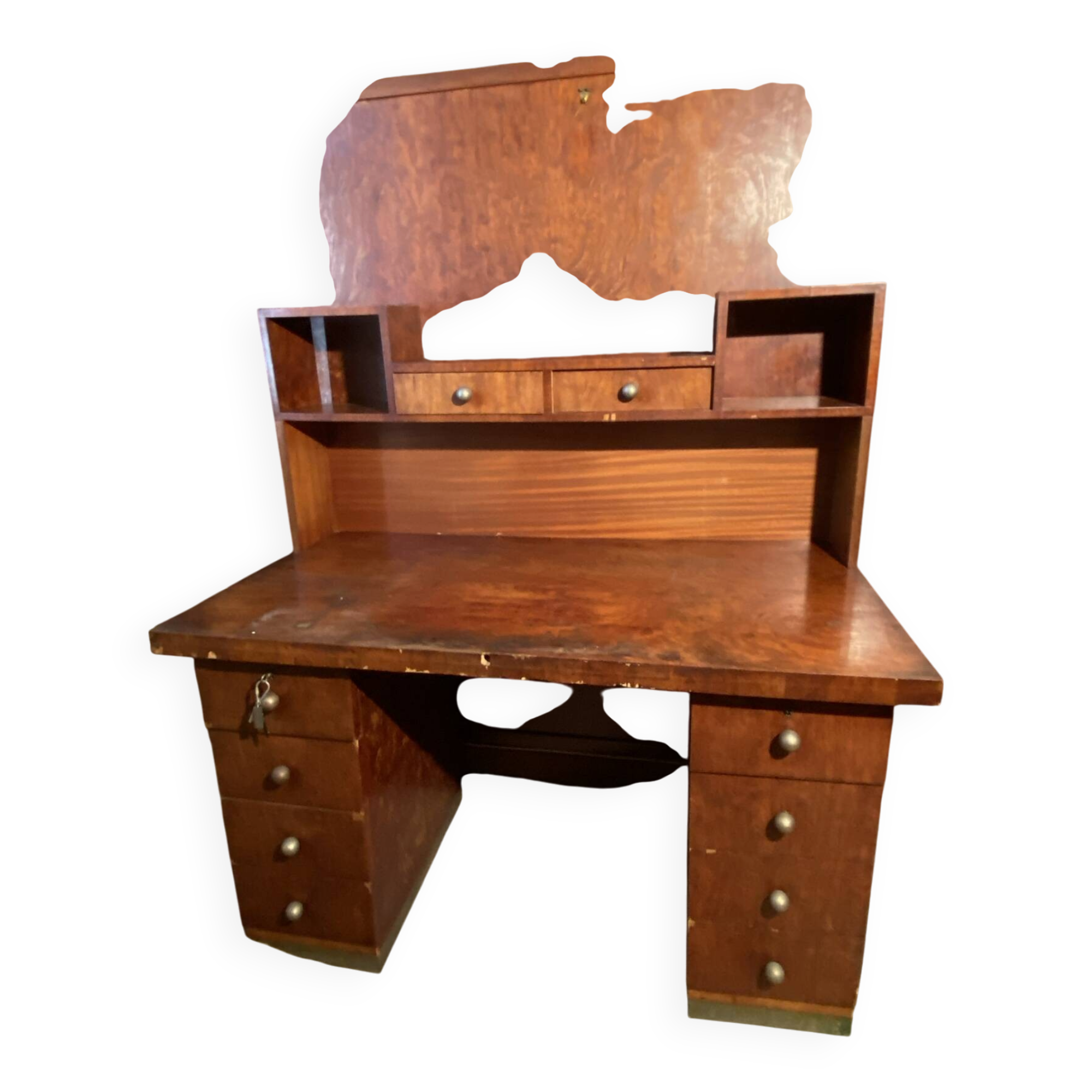 Vintage desk with drawers and a hutch with numerous drawers.