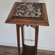 High plant stand in carved wood and Art Nouveau marble.
