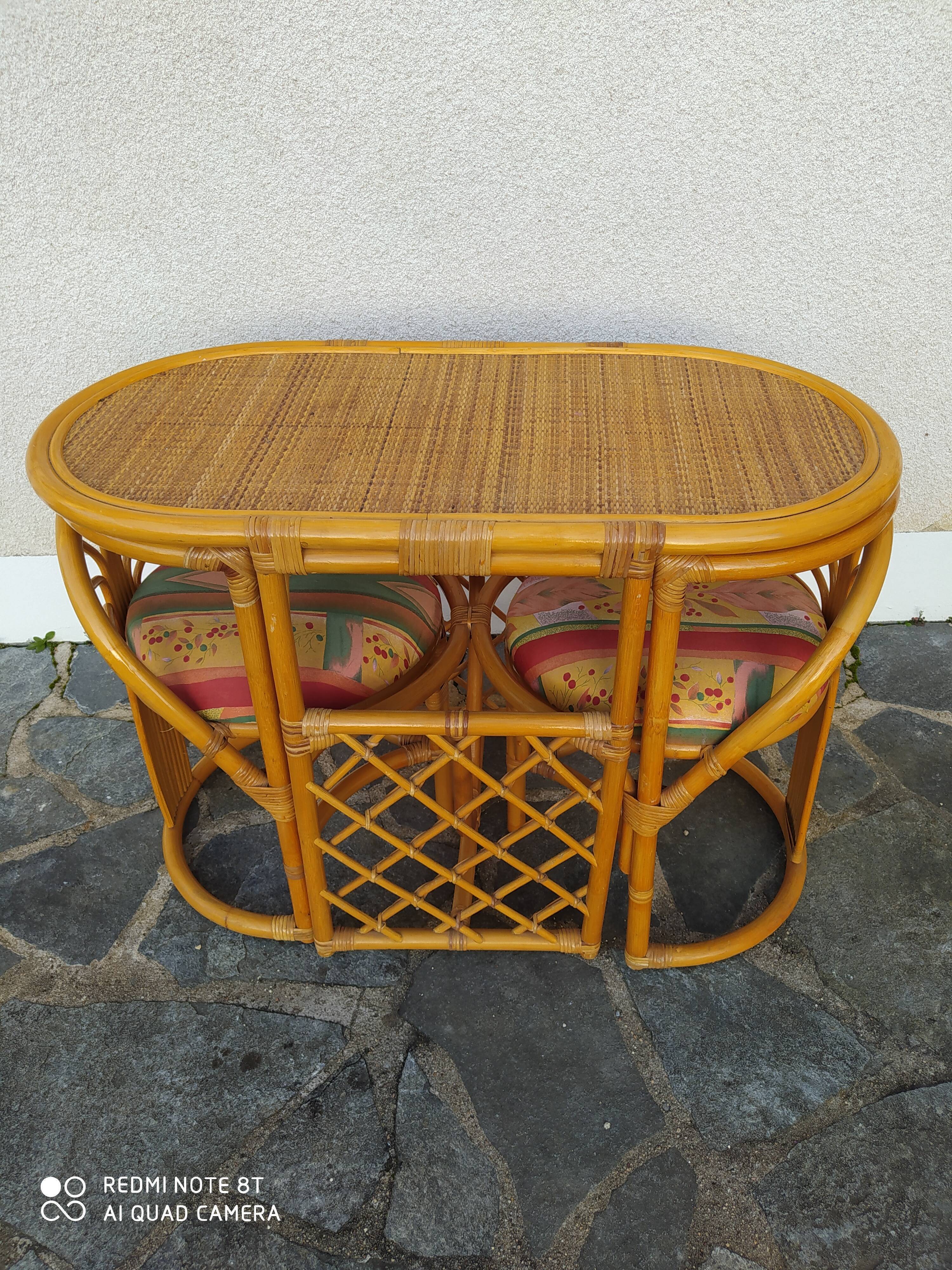 Vintage rattan tête-à-tête table with 2 armchairs