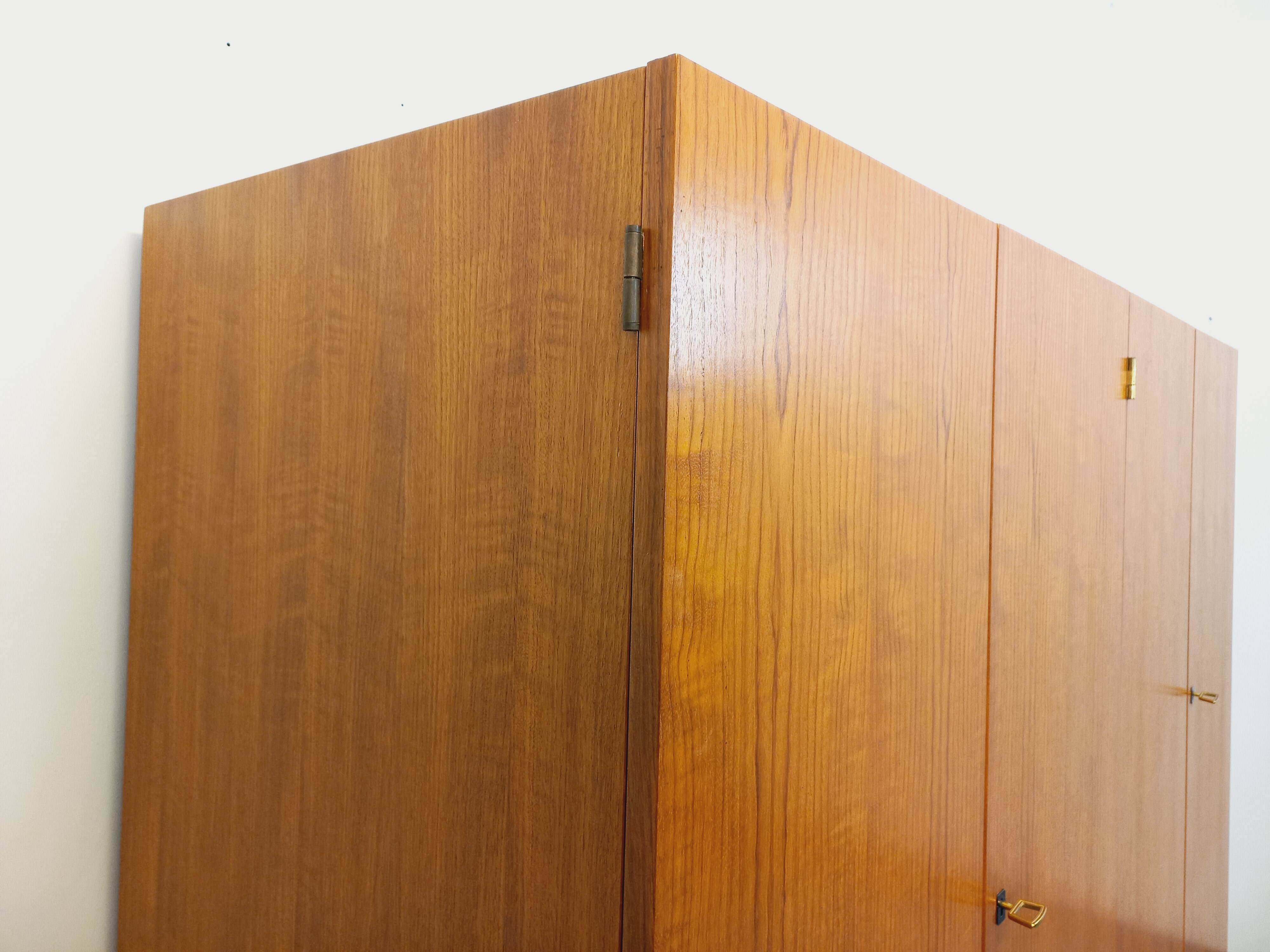 Vintage modernist wardrobe in teak and metal from the 1960s.