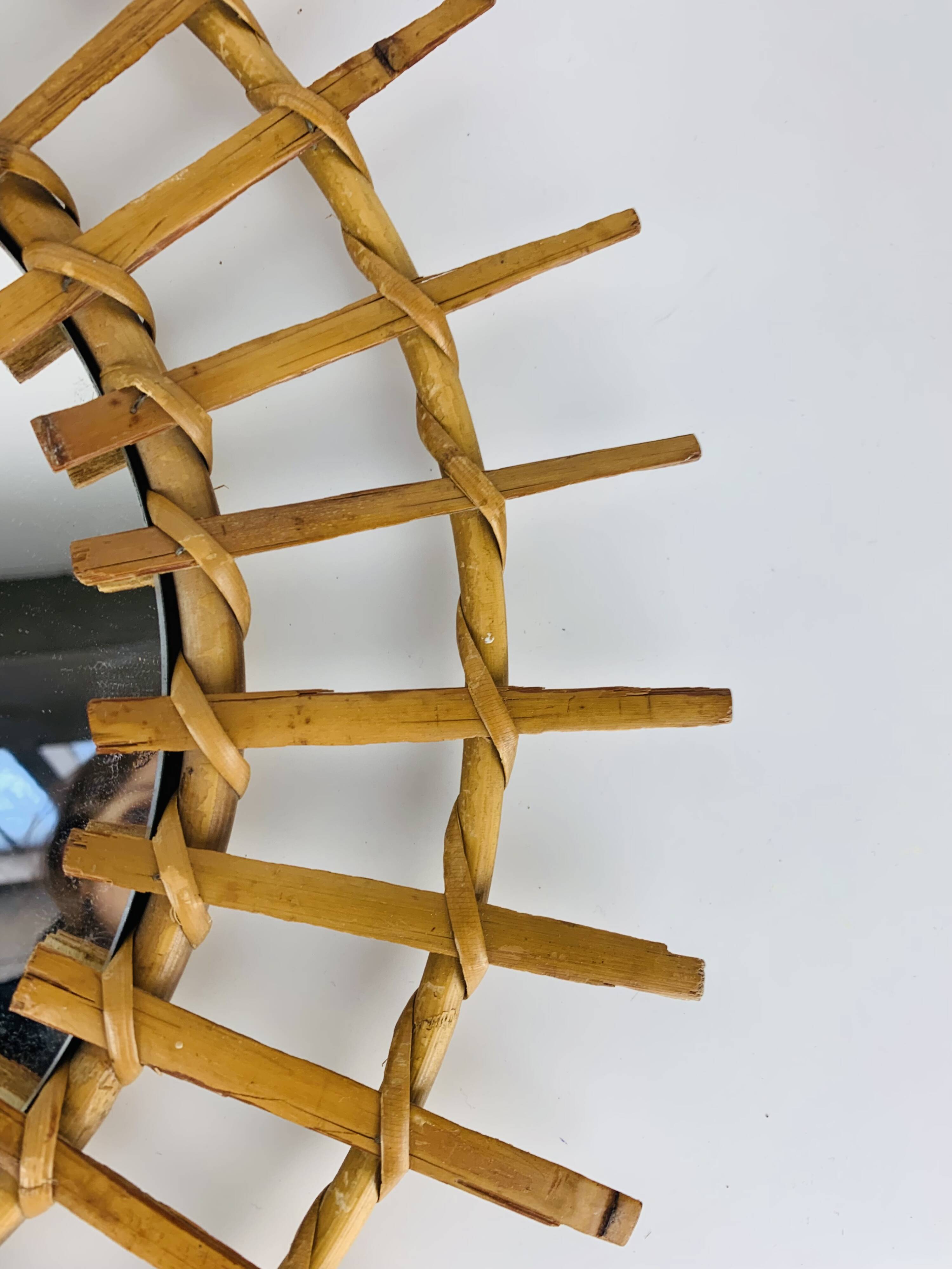 Vintage rattan sunburst mirror from the 1960s
