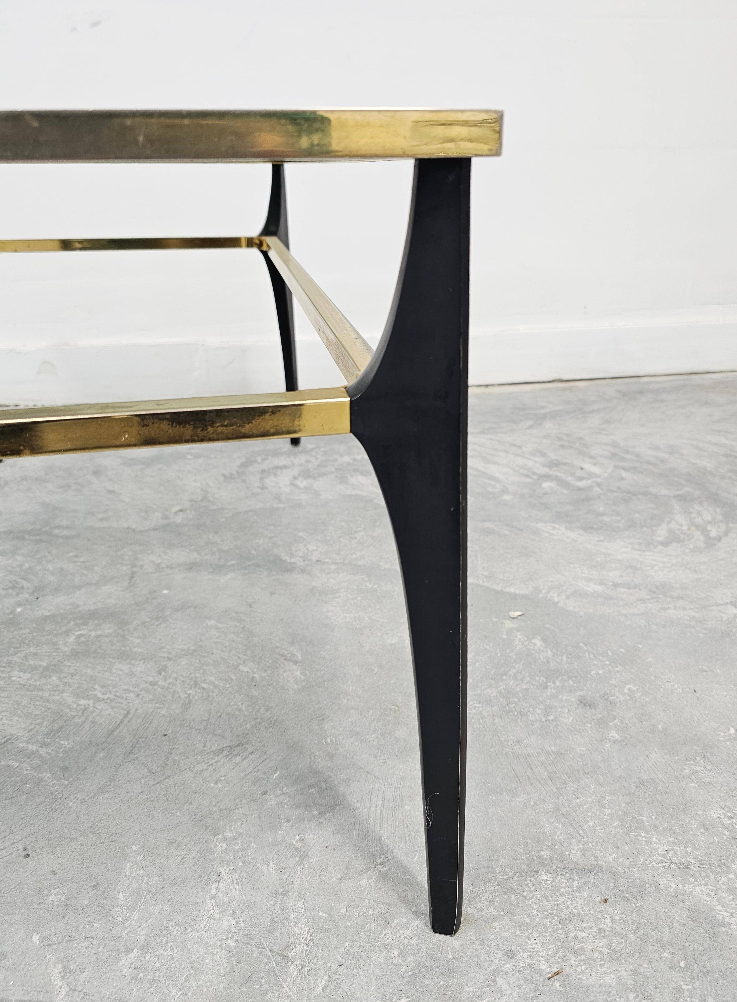 Mid Century Modern coffee table with gold-plated metal and smoked glass.