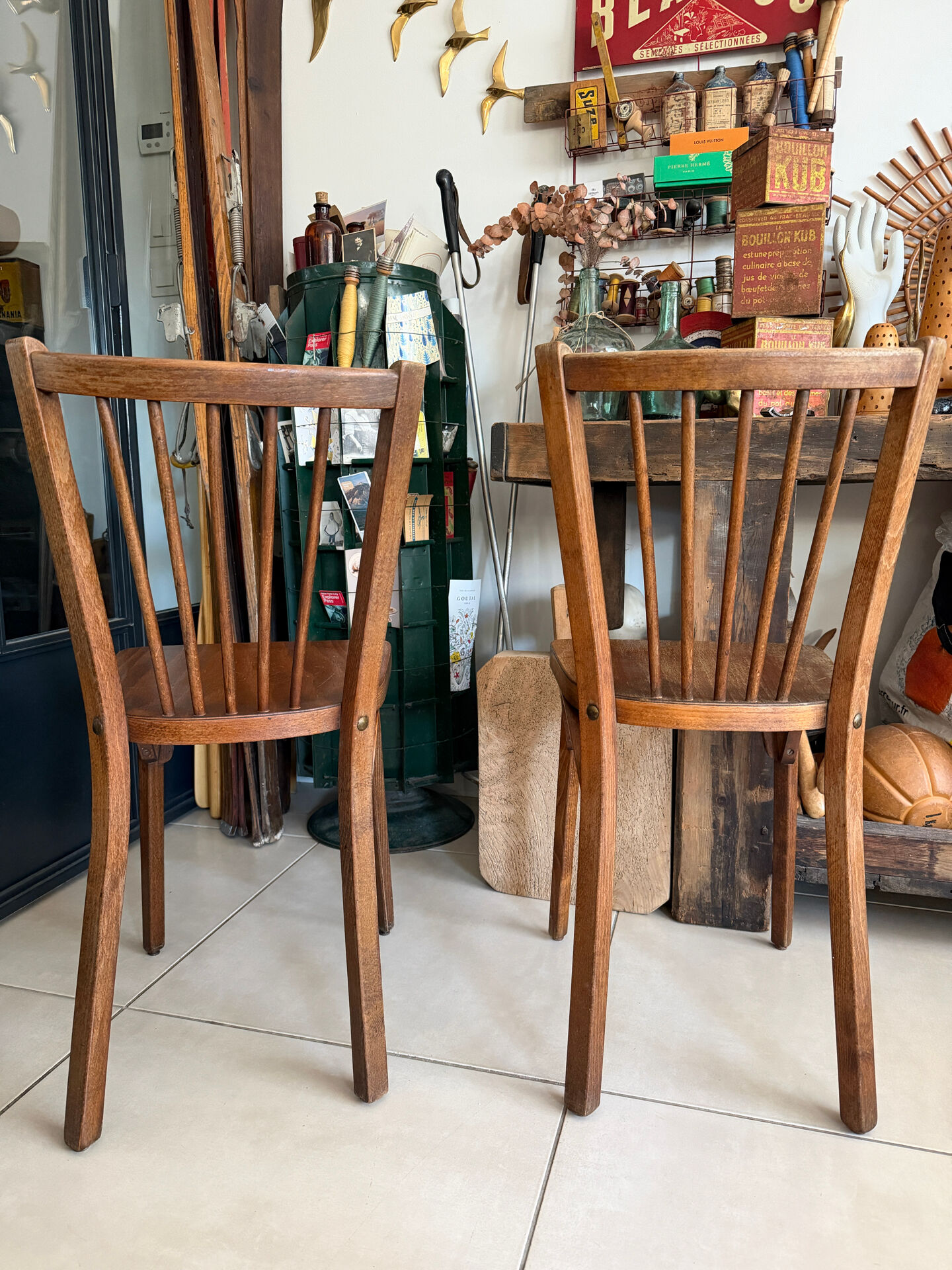 Pair of vintage Baumann bistro chairs in wood.