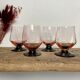 4 pink glasses with black stems