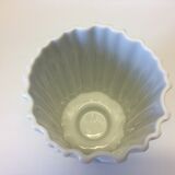 White vase on wooden base