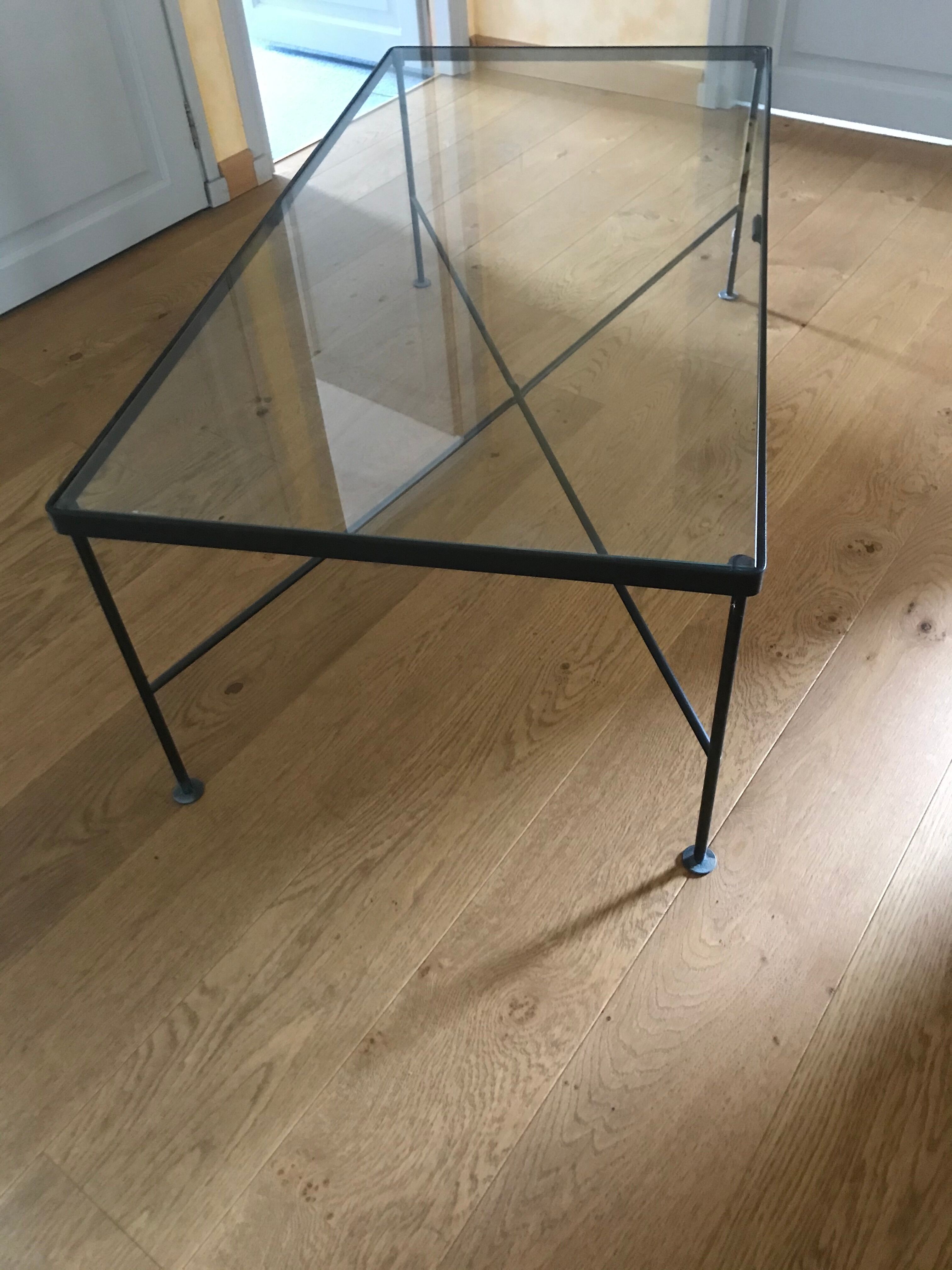 Glass and black metal coffee table