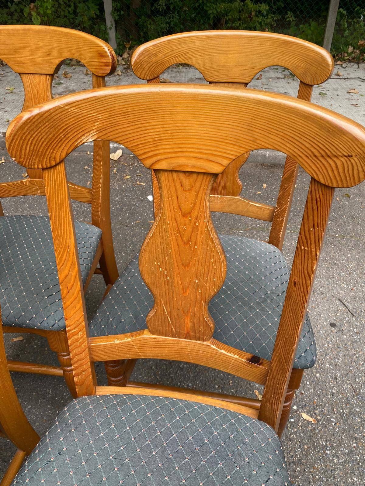 4 Landes chairs with solid wood frames and grey fabric.