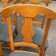4 Landes chairs with solid wood frames and grey fabric.