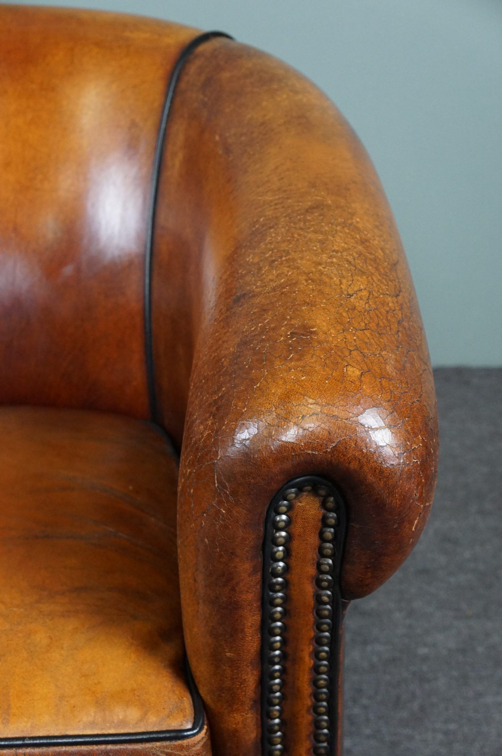 Set of 2 club chairs in black piping sheep leather