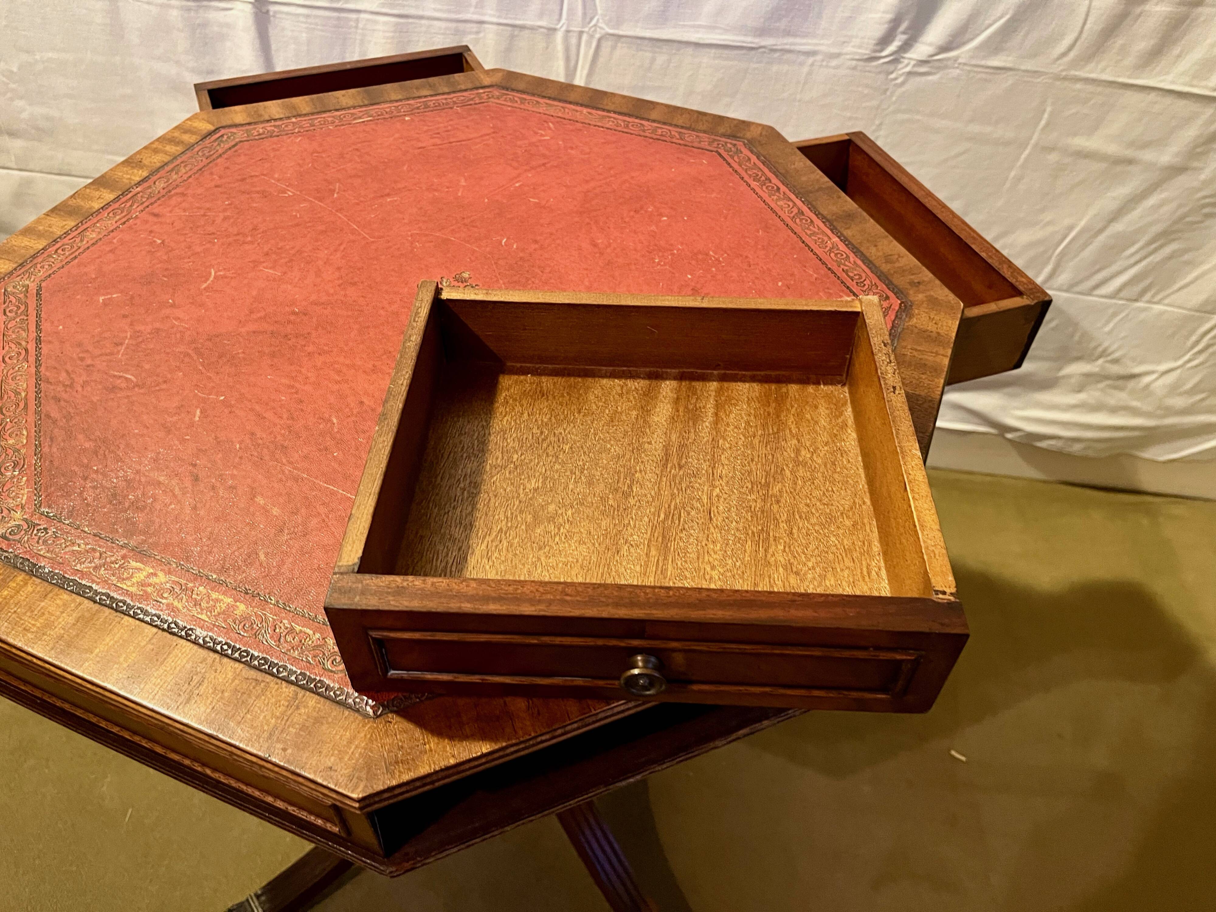 Vintage octagonal gueridon, 4 drawers, leather top, lion's paw feet.