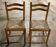 Pair of wooden and straw chairs in very good condition.