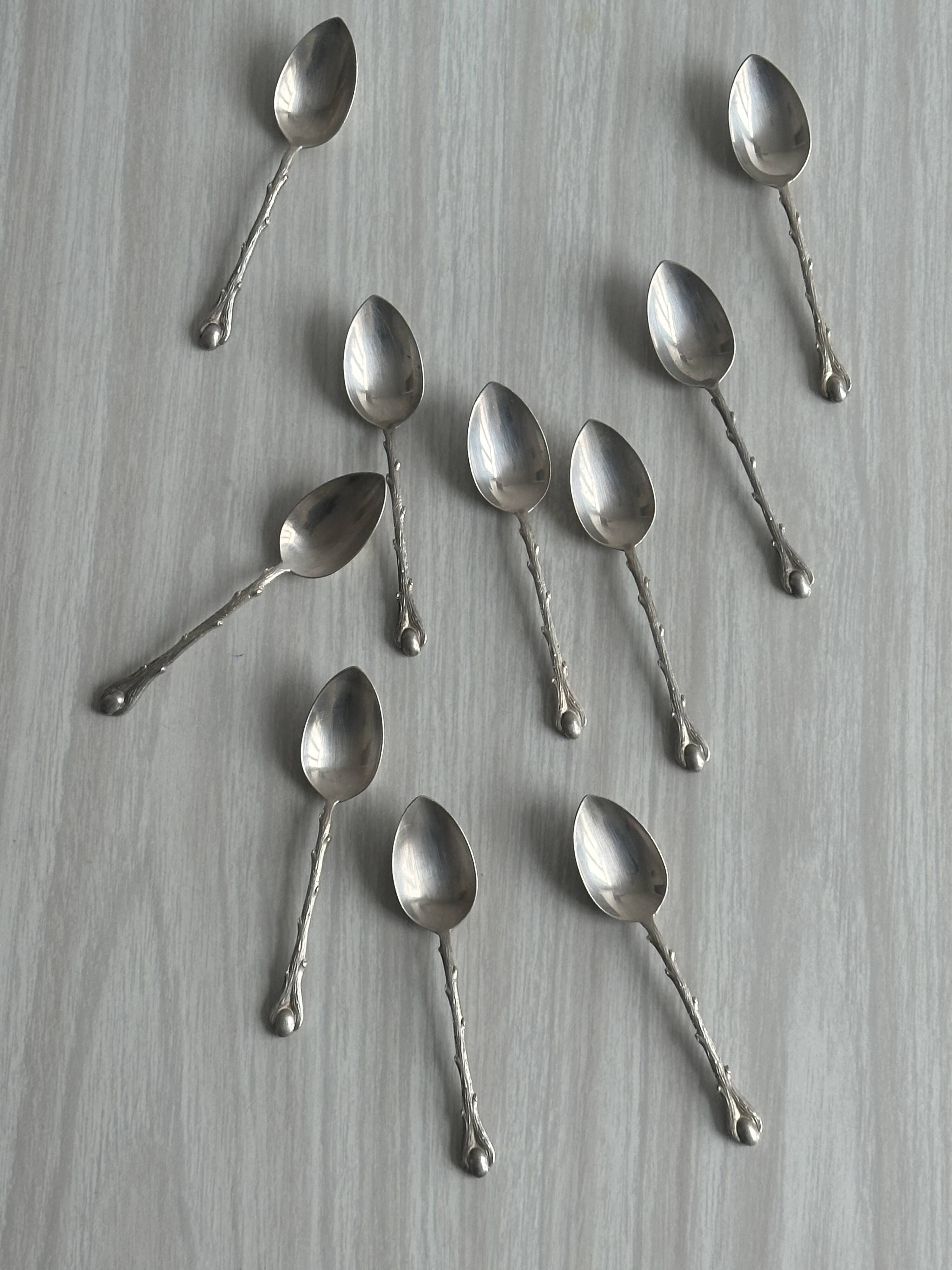 Set of 10 small silver metal spoons