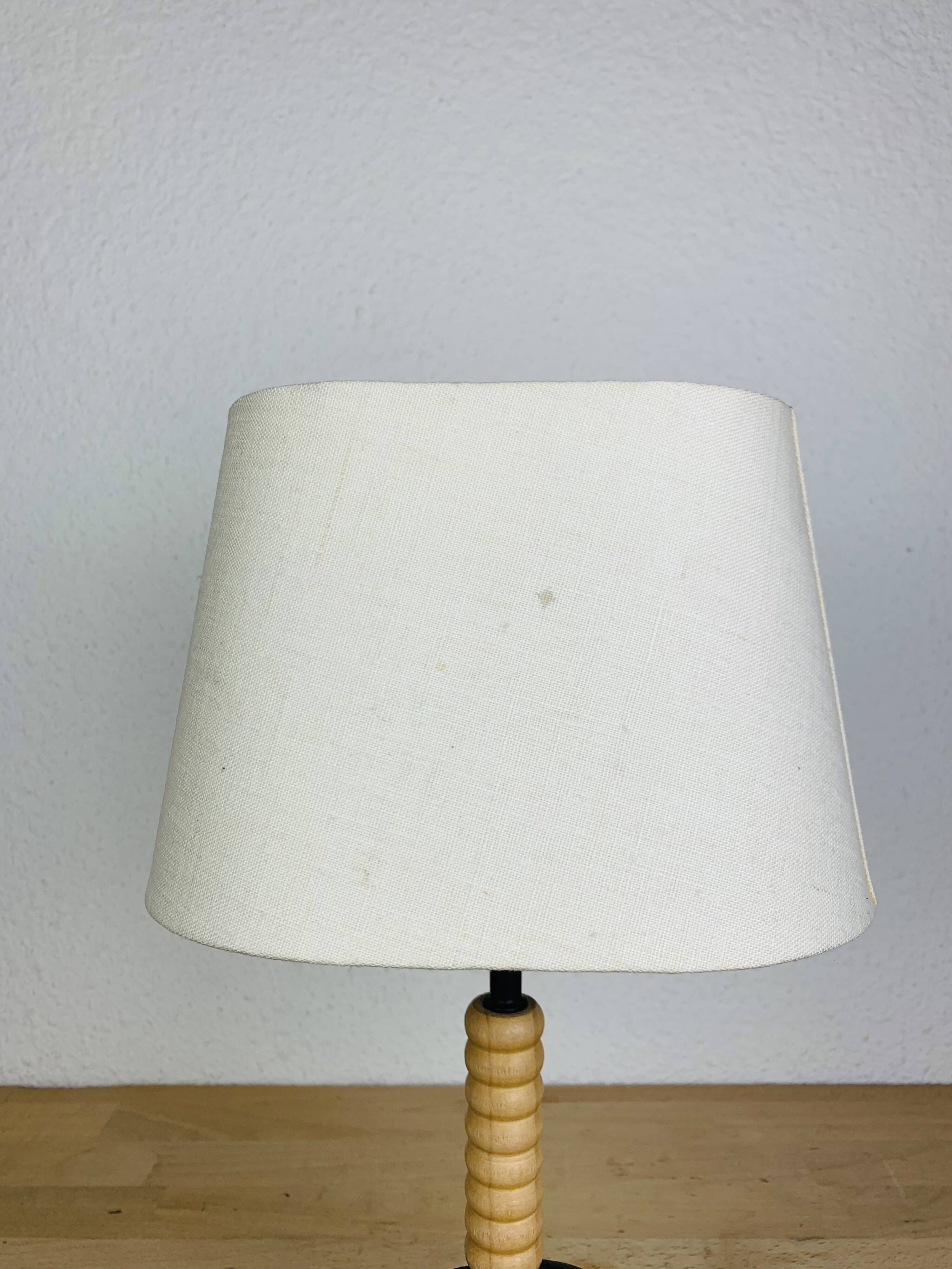 Wrought iron and wood tripod lamp