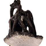 African stone sculpture of 3 Giraffes
