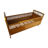 Old wooden and rattan bed for baby