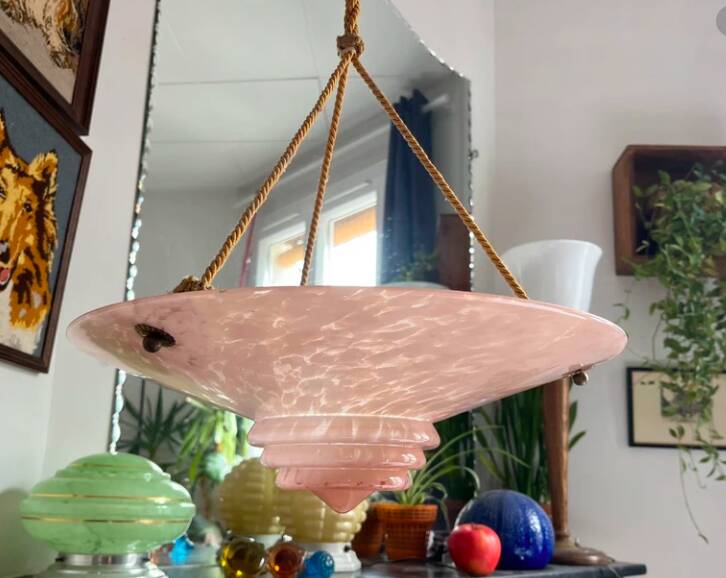 Art Deco basin suspension with pink glass and fabric cords.