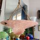 Art Deco basin suspension with pink glass and fabric cords.