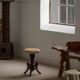 Adjustable Victorian-style piano stool with a jute fabric seat, early 20th century.