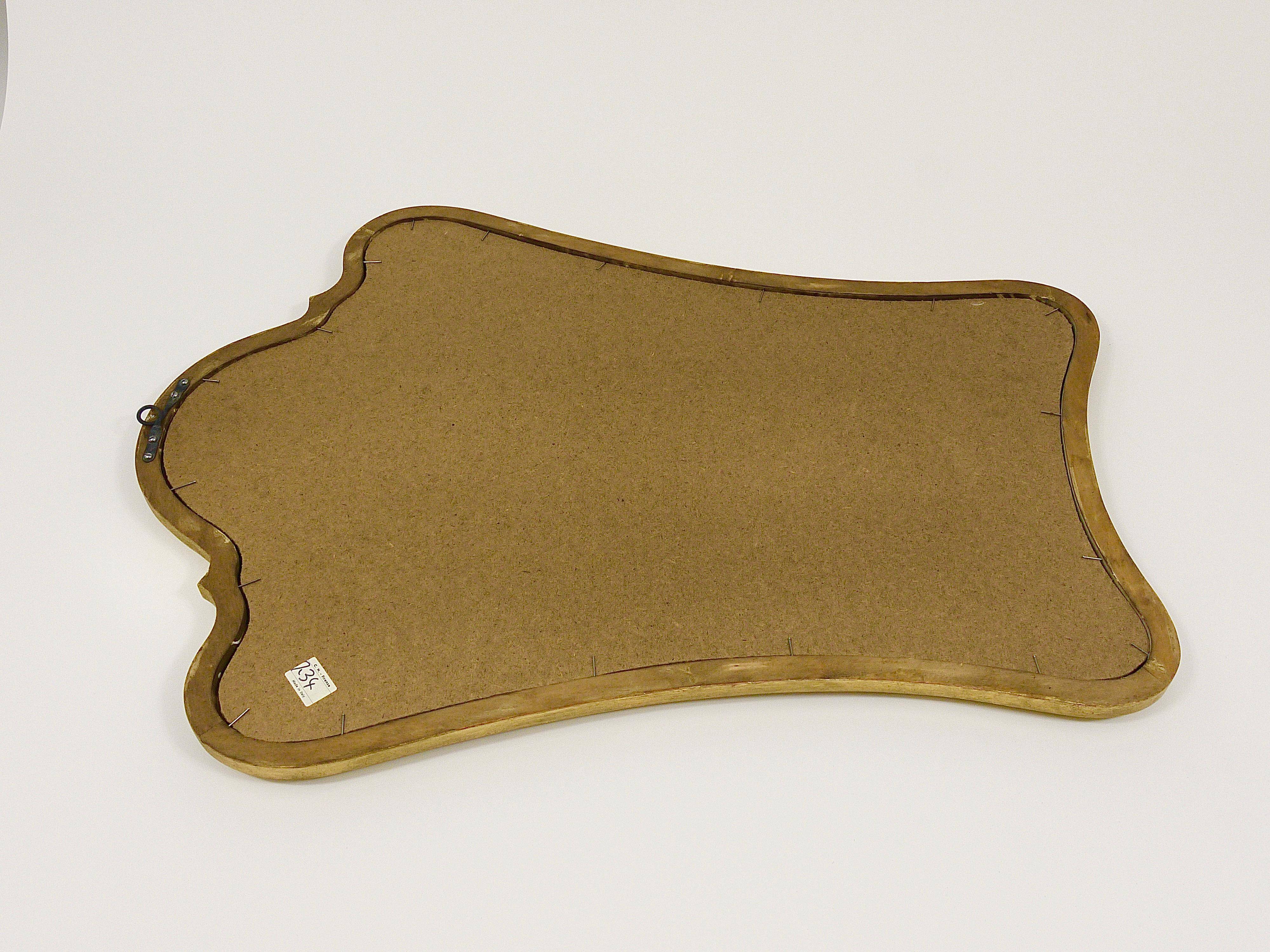 Curved wall mirror in gilded wood Chelini Firenze, mid-century, Italy, 1950s.