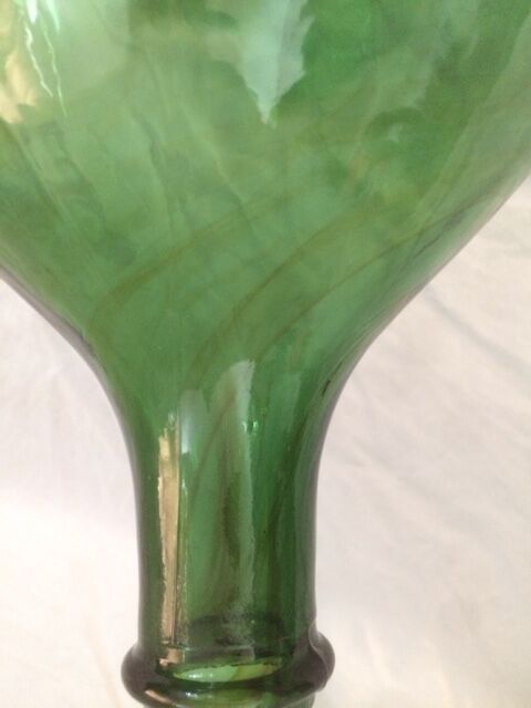 Demijohn with a beautiful glass mixing green and brown