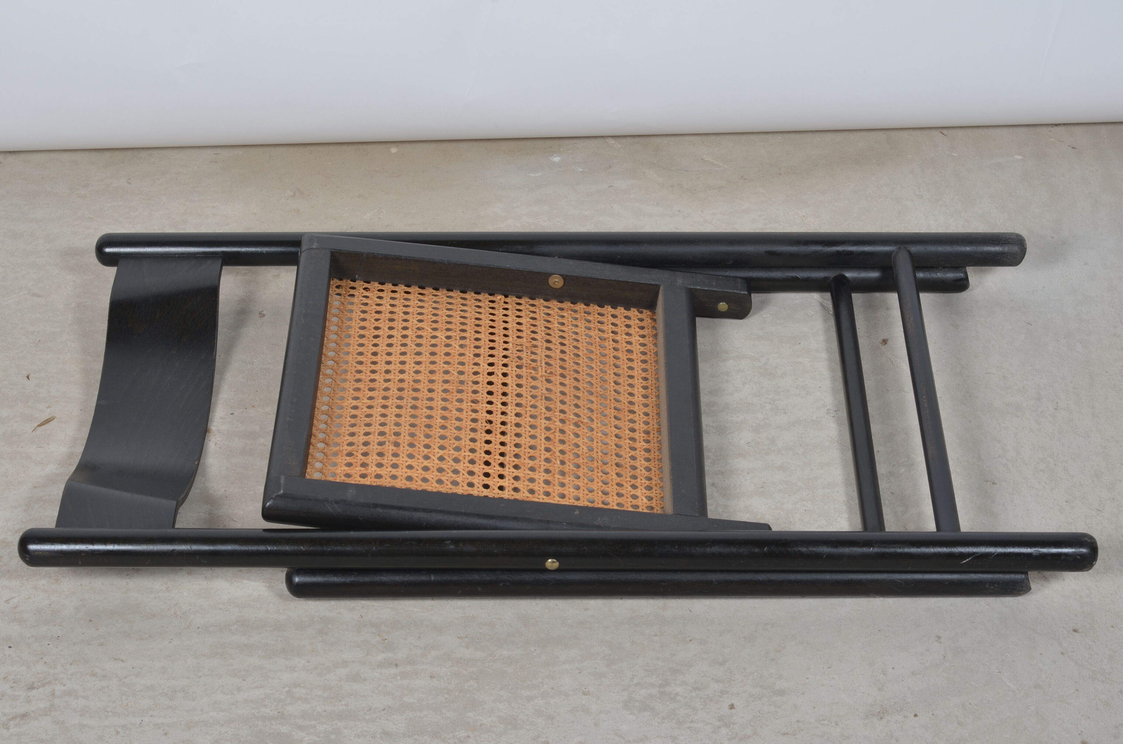 Folding chair seated in cannage