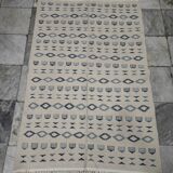 Handmade white and blue rug made of natural wool