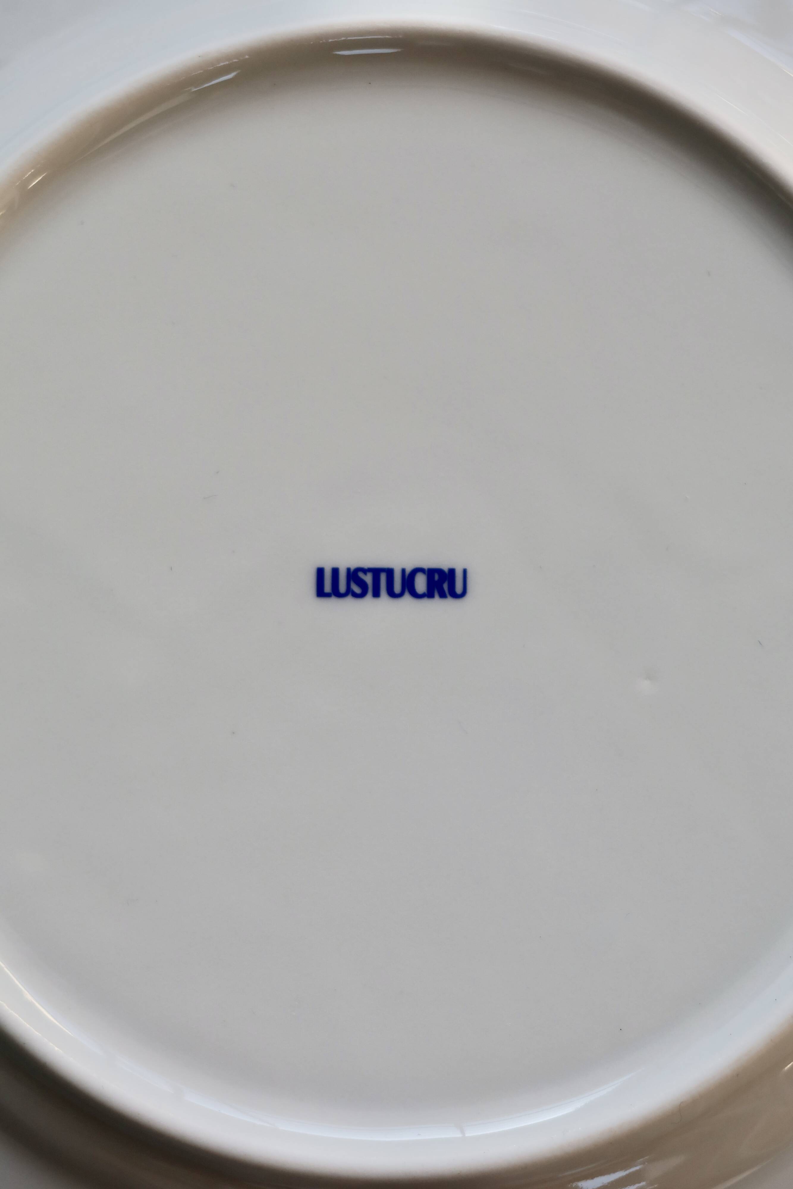 6 vintage Lustucru porcelain plates with a blue checkerboard pattern