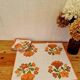 Set of 5 vintage orange flower table napkins from the 70s.