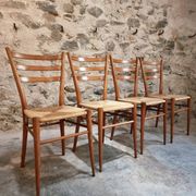 Set of 4 mid-century Italian dining chairs with woven seats, circa 1950–1970.