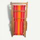 Vintage deck chair with red and orange striped fabric, original patina.