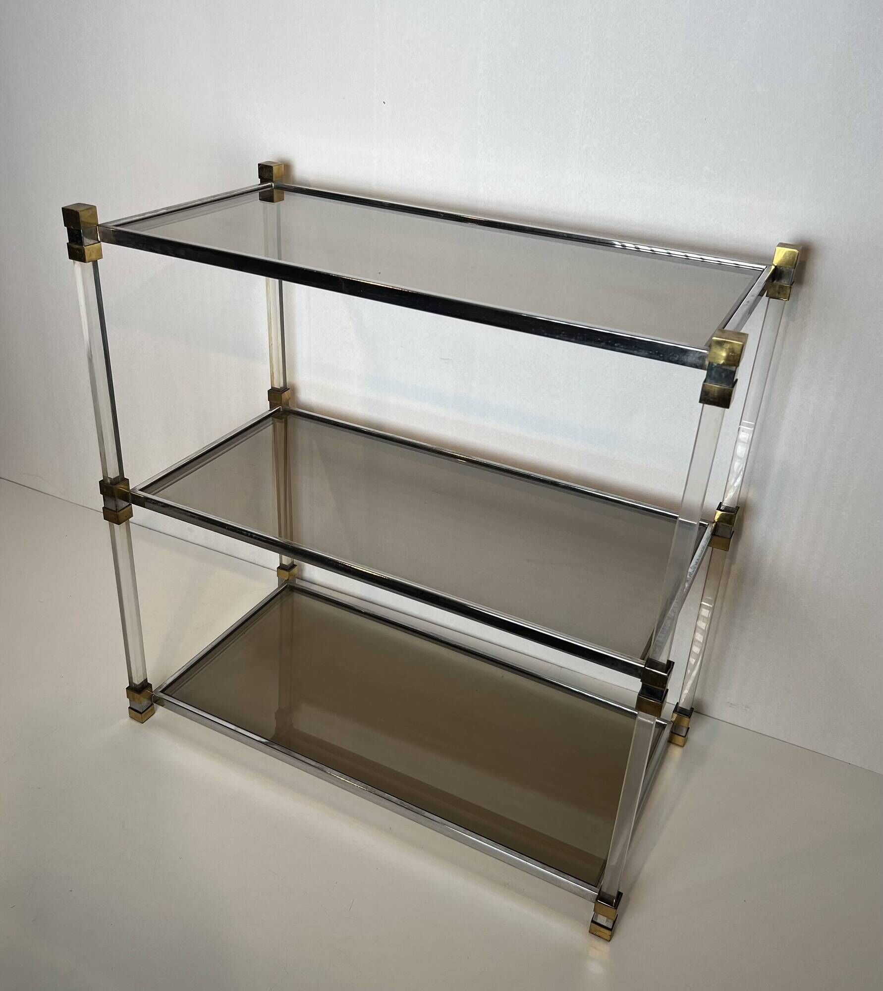 Lucite Shelf with Three Smoked Glass Shelves and Brass Ends. Work