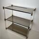 Lucite Shelf with Three Smoked Glass Shelves and Brass Ends. Work