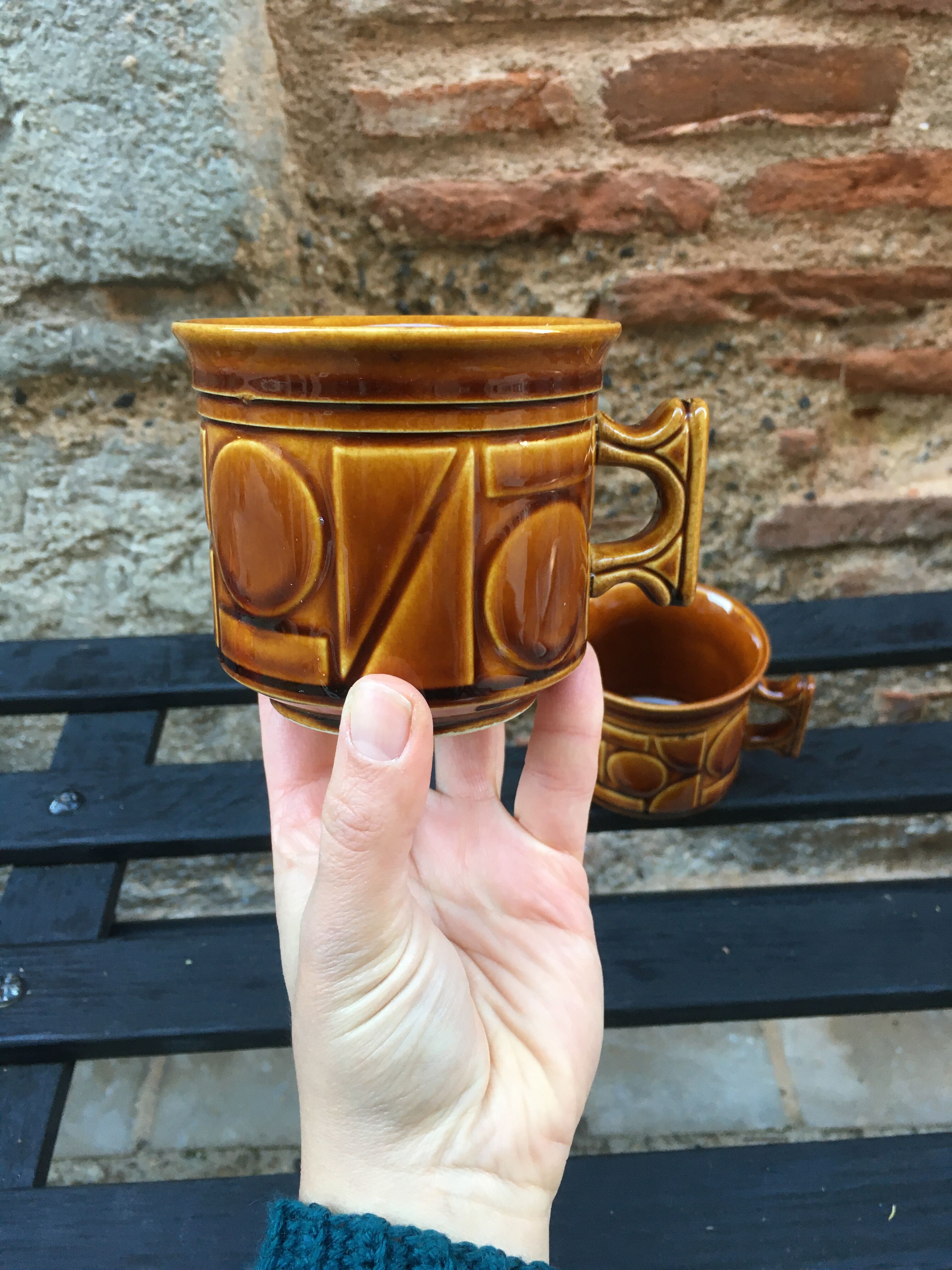 Two brown coffee cups