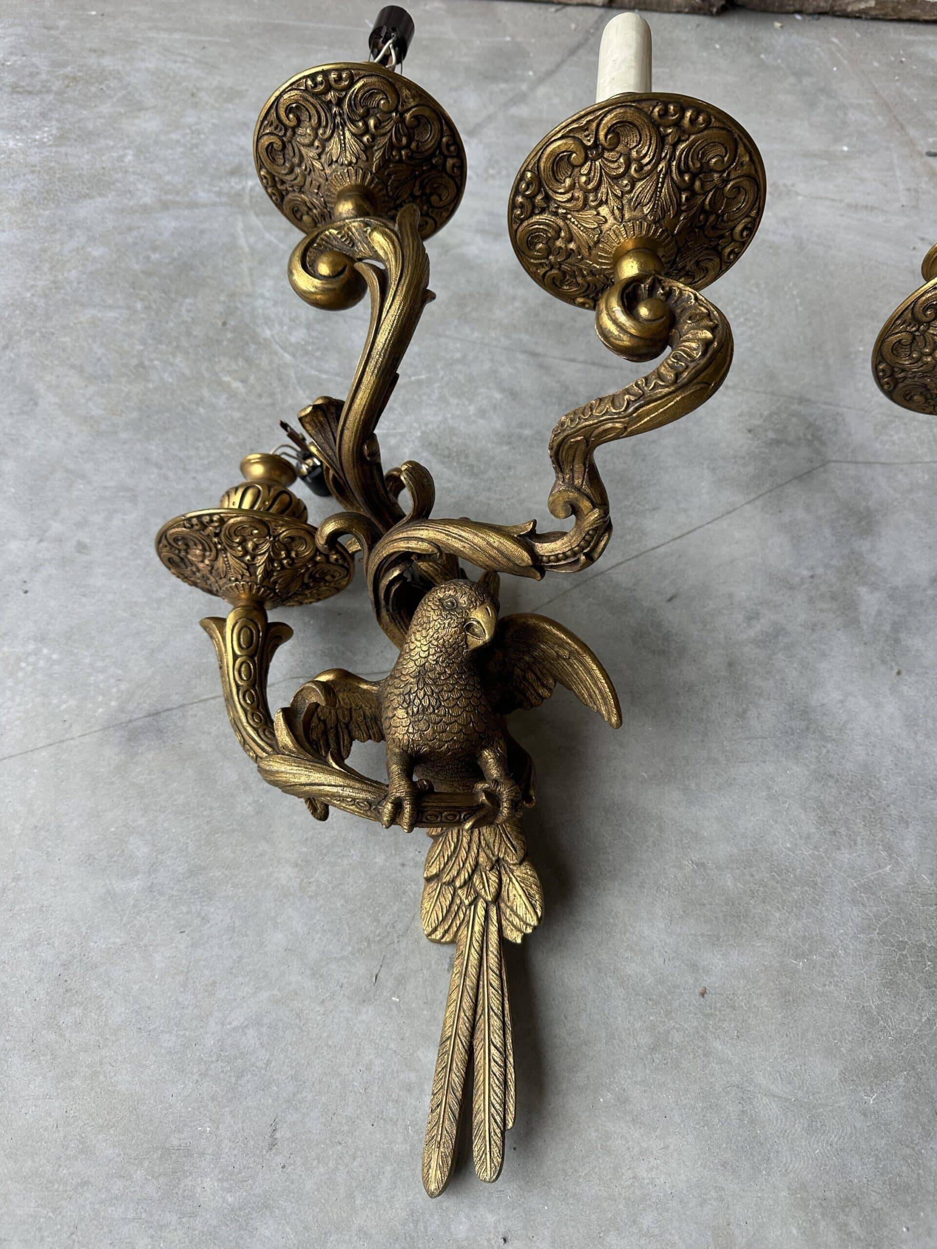 Pair of bronze wall sconces with parrots, early 20th century.
