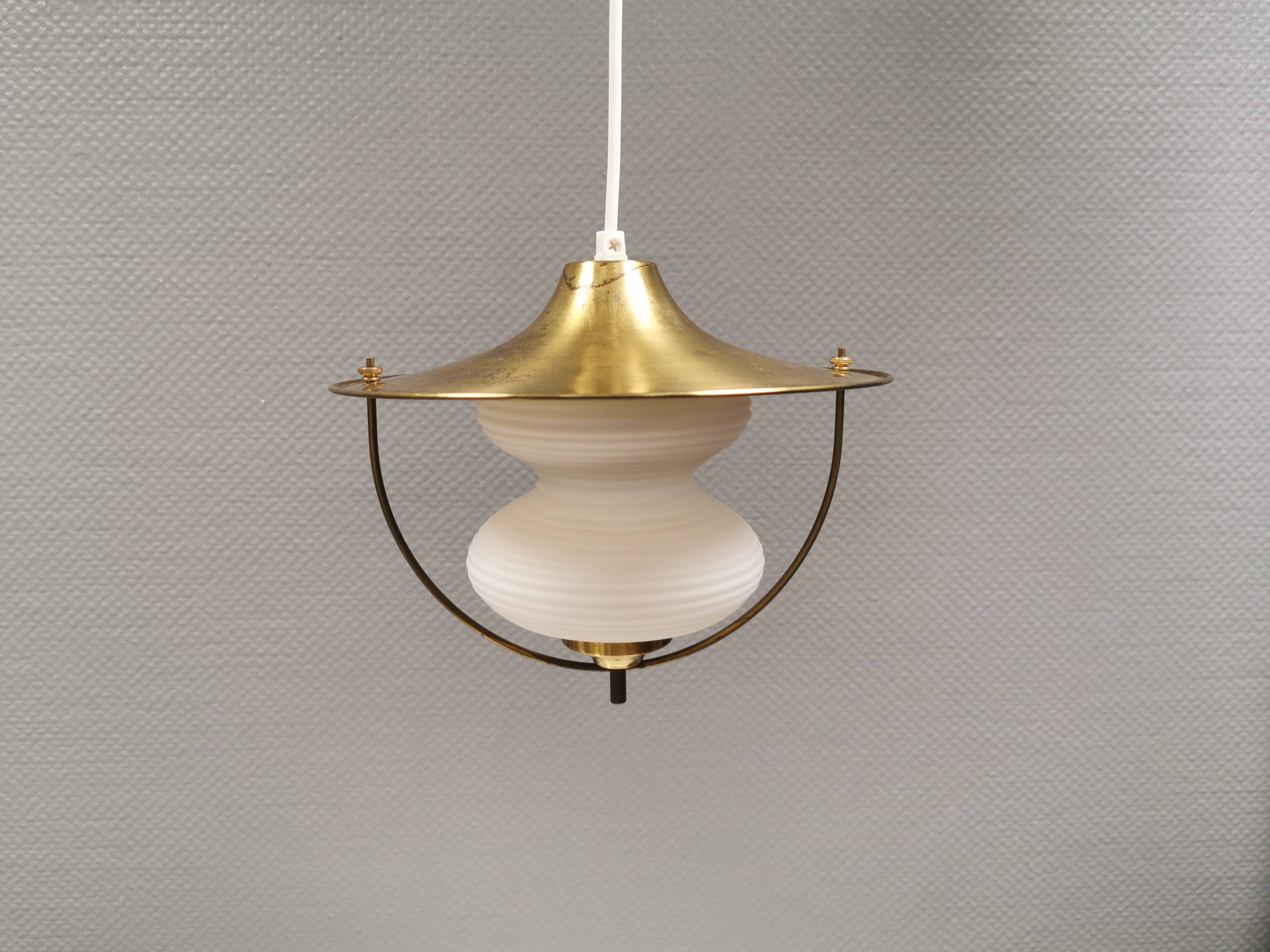 Beautiful older hanging lamp in brass and milky white glass. Germany 1950s