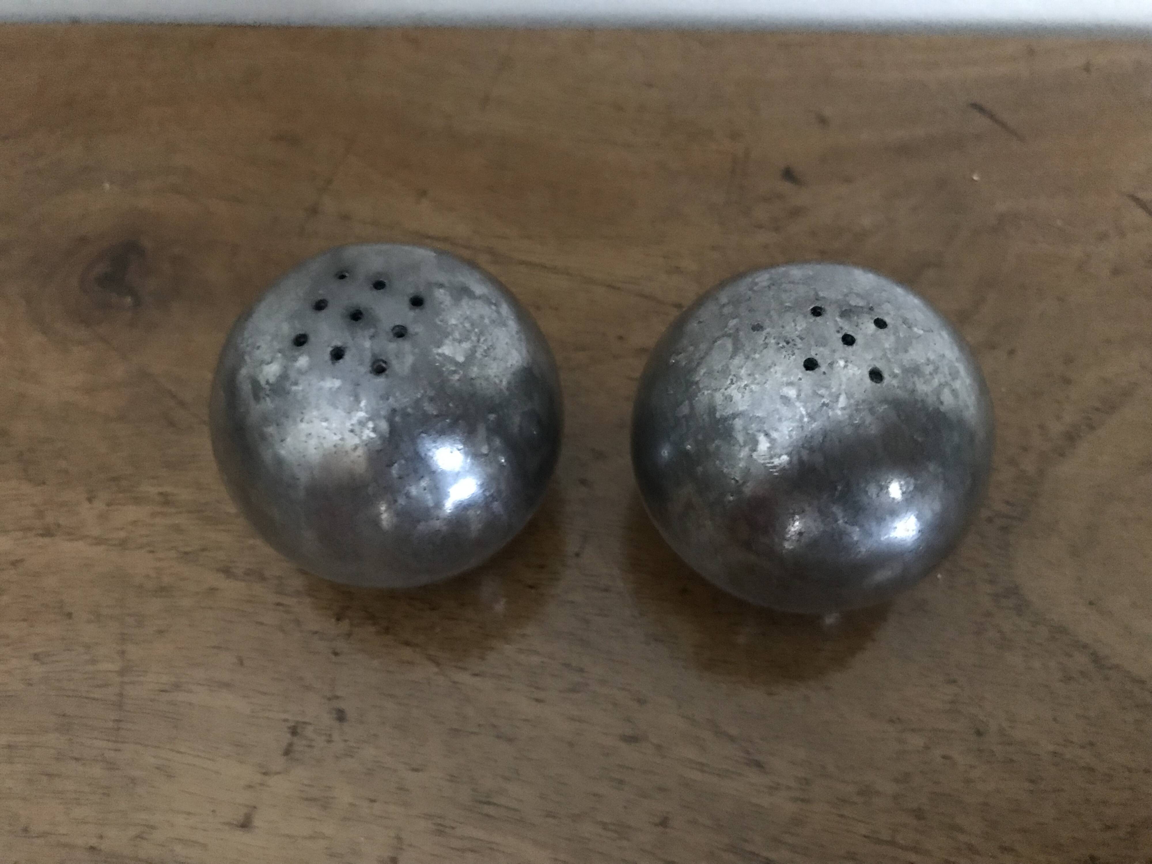 Brutalist salt and pepper ball in cast steel
