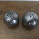 Brutalist salt and pepper ball in cast steel
