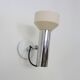 Adjustable wall spotlight in chrome-plated and white lacquered metal. 1970s