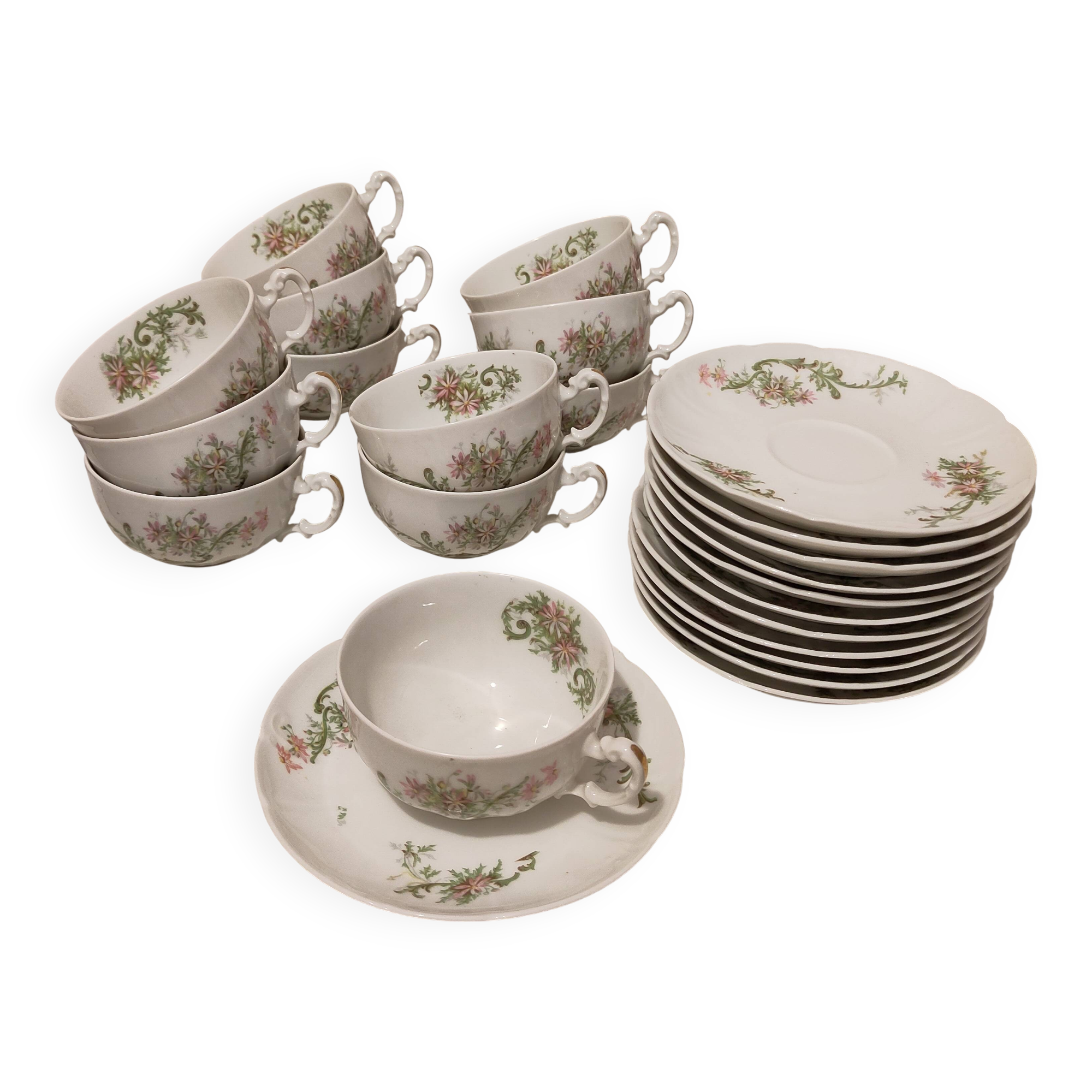 Coffee and tea cup service with plates and saucers.