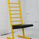 Adjustable seat chair. Circa 1980. Italy. Yellow lacquered steel.