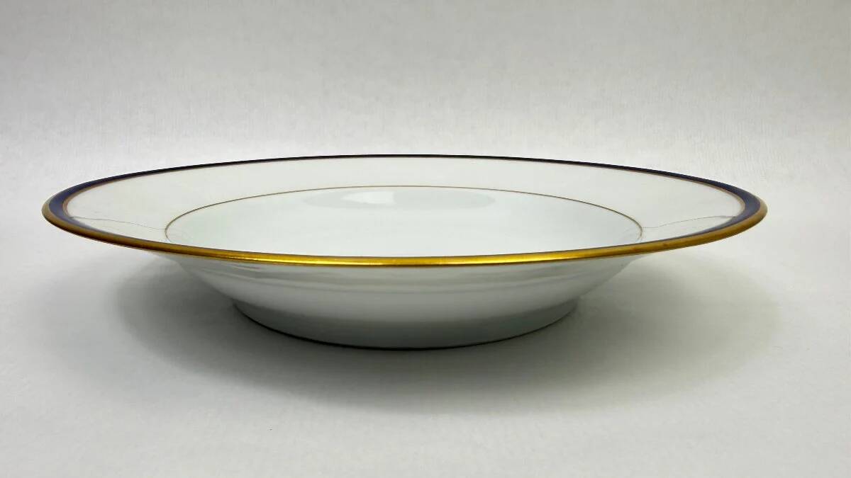 45-piece table service in Limoges porcelain by Chastagner, blue and gold.