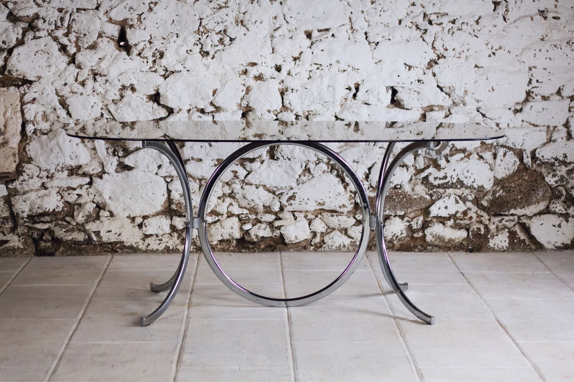 Chrome and smoked glass dining table in the style of Gastone Rinaldi, 1970.