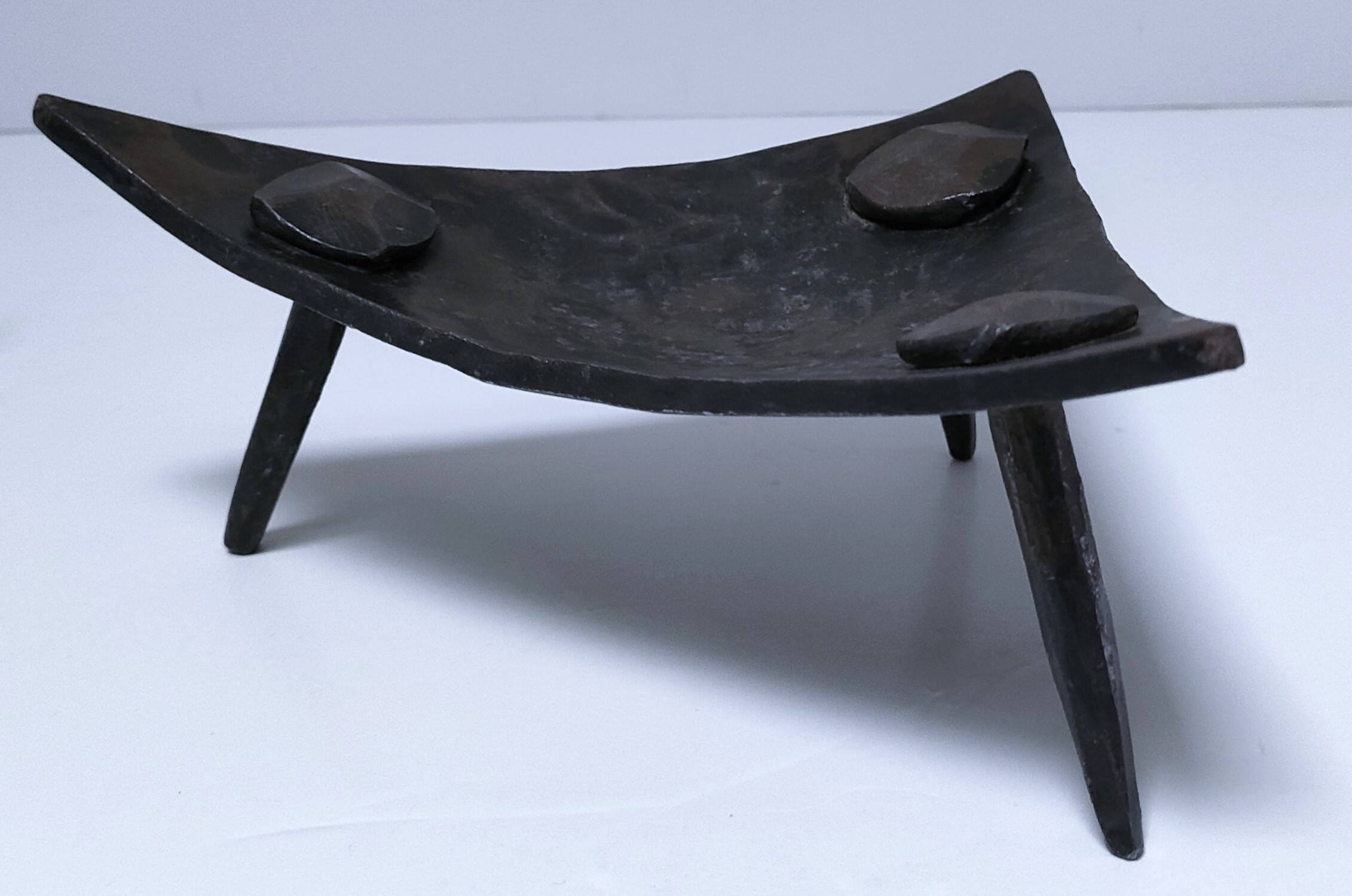 Brutalist metal pocket with patinated tripod