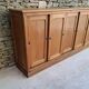 Oak workshop furniture with sliding doors.